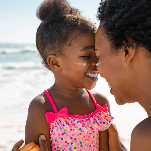 Mother smiling and connecting with her child after taking Dr. Siggie's parenting courses.