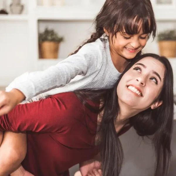 Mother interacting with a child to demonstrate practical parenting tools