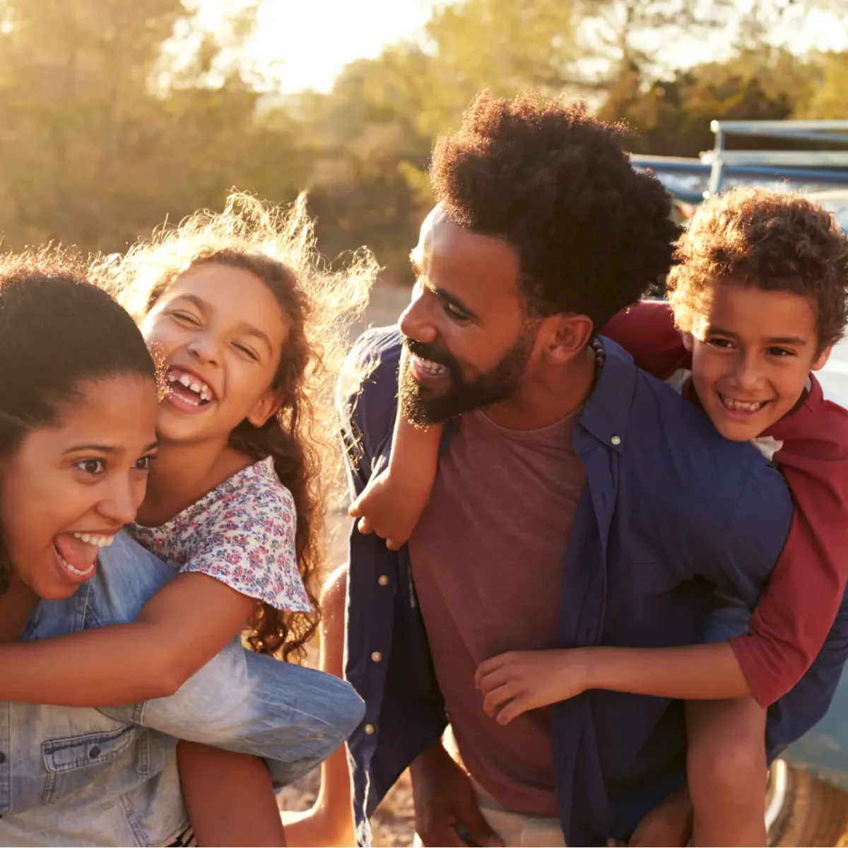 Happy family outdoors after building confidence and coping skills through Dr. Siggie's courses